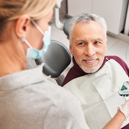 Man in dental chair making impressions for dentures