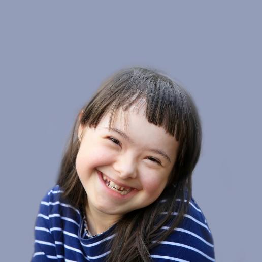 Young girl with special needs grinning