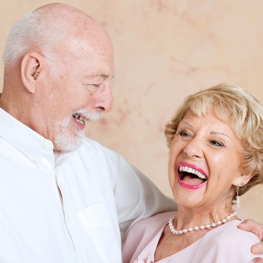 Senior man and woman laughing together