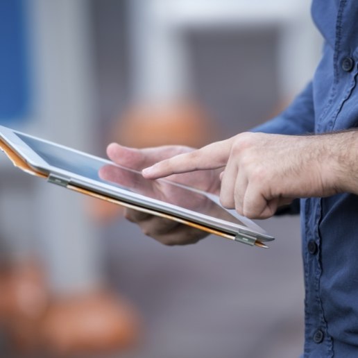 Person touching a tablet screen