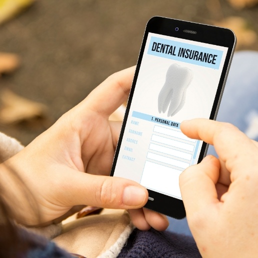 Person filling out dental insurance forms on their smartphone