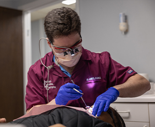 Doctor David Fried giving a patient a dental exam