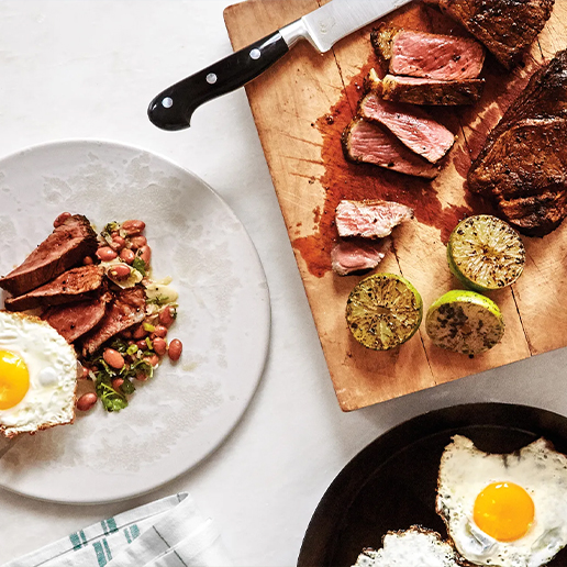 Plate cutting board and frying pan with different types of food on them