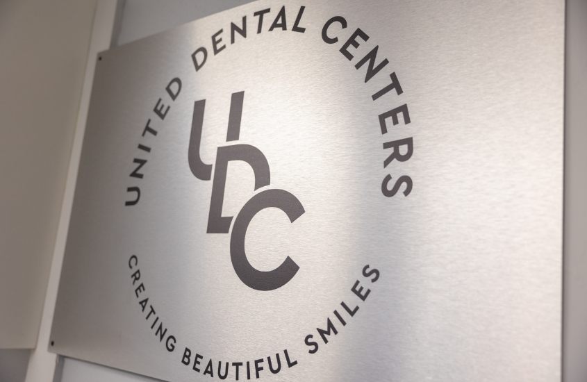 Sign reading United Dental Centers Creating Beautiful Smiles