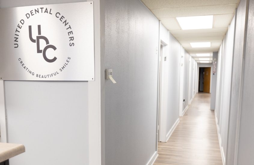 White hallway leading to dental treatment rooms