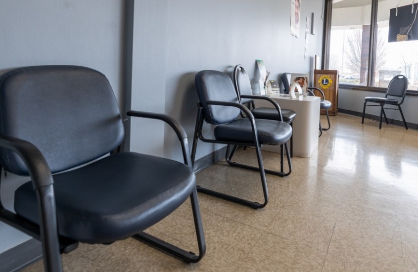Empty black chairs in waiting room of Hammond dental office