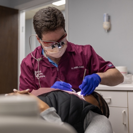 Doctor Fried performing a dental checkup in Hammond