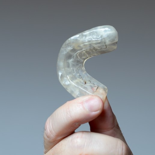 Person holding dental nightguard