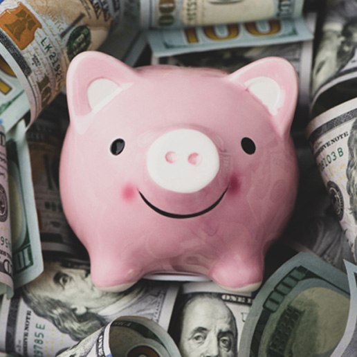 Piggy bank on a pile of money